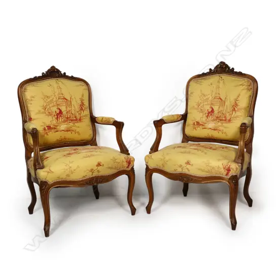 A pair of French open elbow armchairs,