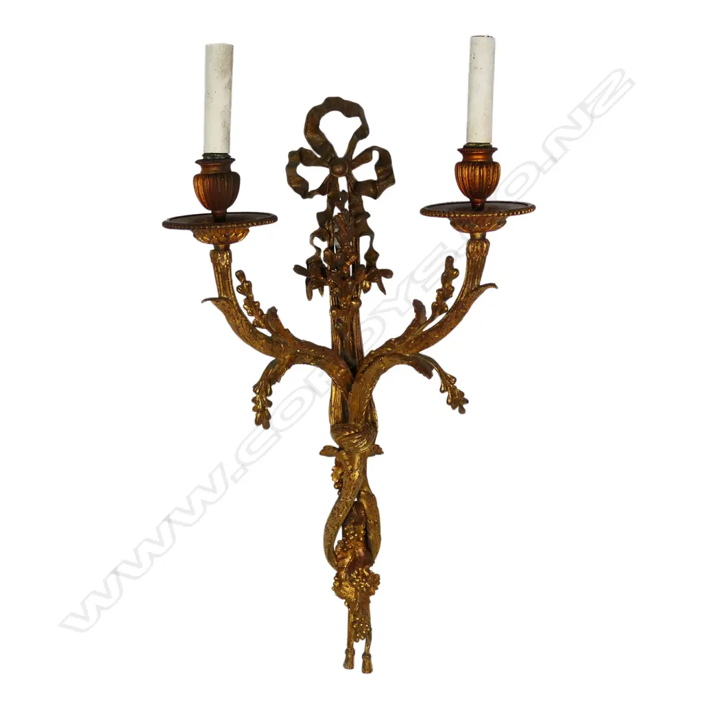 An early 20thC French gilded bronze wall sconce in the form of budding branches held together by a bow, two light branches. Requires rewiring. 330 x 570mm. Image 1++