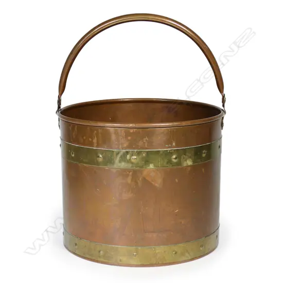 A large vintage copper bucket,