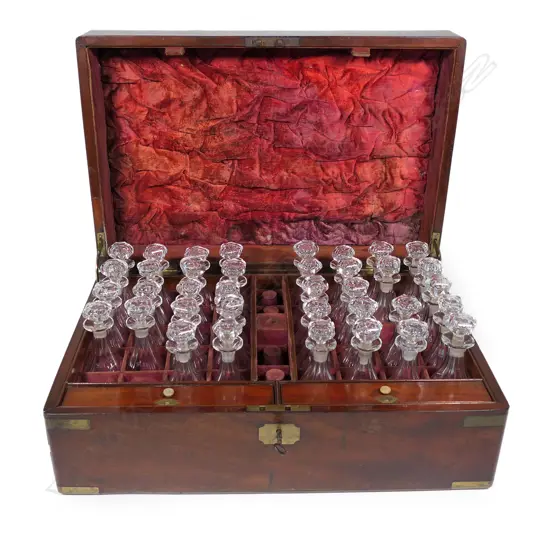 A 19thC Regimental mahogany and brass bound military campaign decanter box,