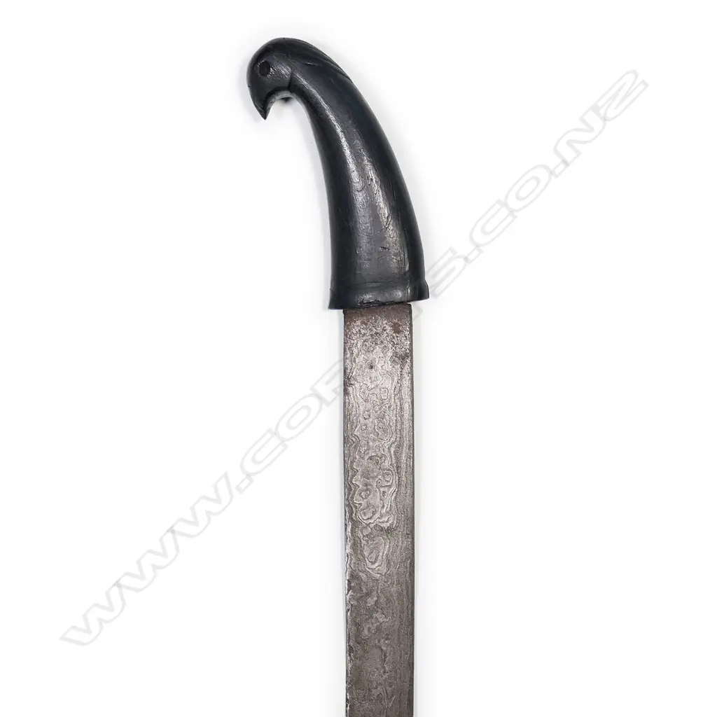 A Javanese heavy short sword, with bird’s head hilt, watered straight blade, Image 1++