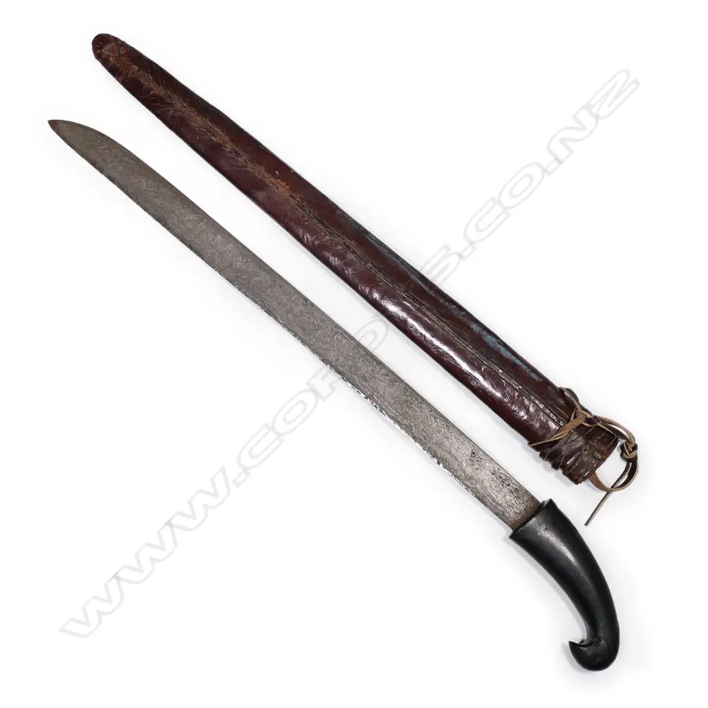 A Javanese heavy short sword, with bird’s head hilt, watered straight blade, Image 1++
