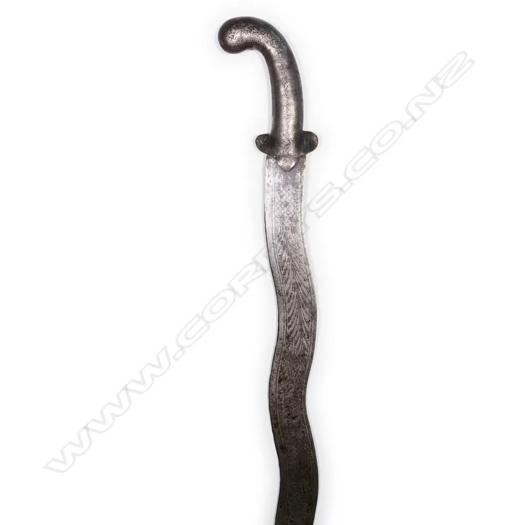 A Northern Indian sword with wavy blade, silver inlaid handle, Image 1++