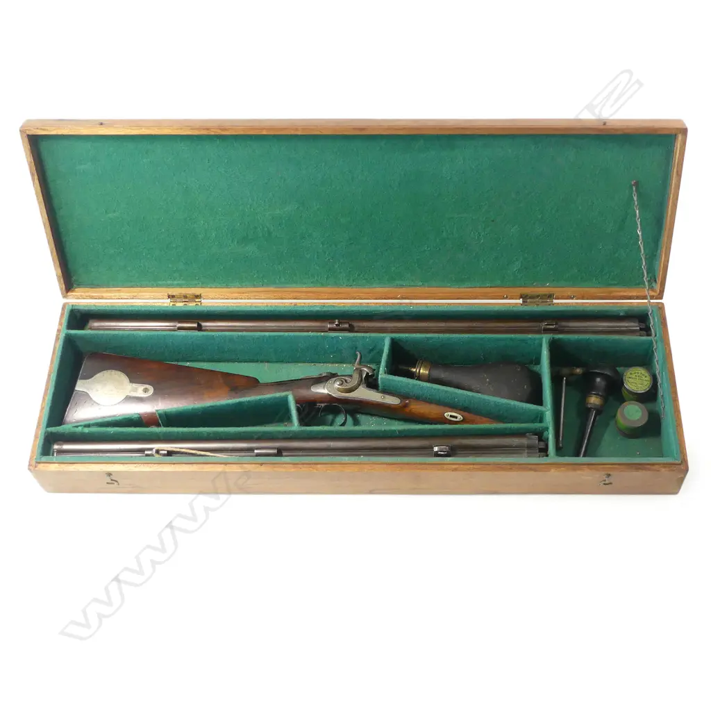 A fine muzzle loading percussion double barrel rifle/shotgun, cased, with two sets of barrels, by Franz Leutheuser, Graz, Austria, c.1860. Image 1++