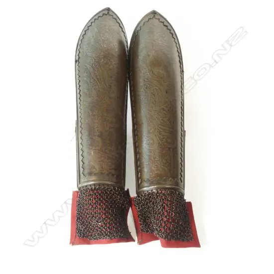 A pair of early 19thC Indo-Persian steel forearm armour (bazu-bund),