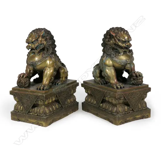 A pair of impressive and well modelled vintage Chinese bronze Foo dogs,