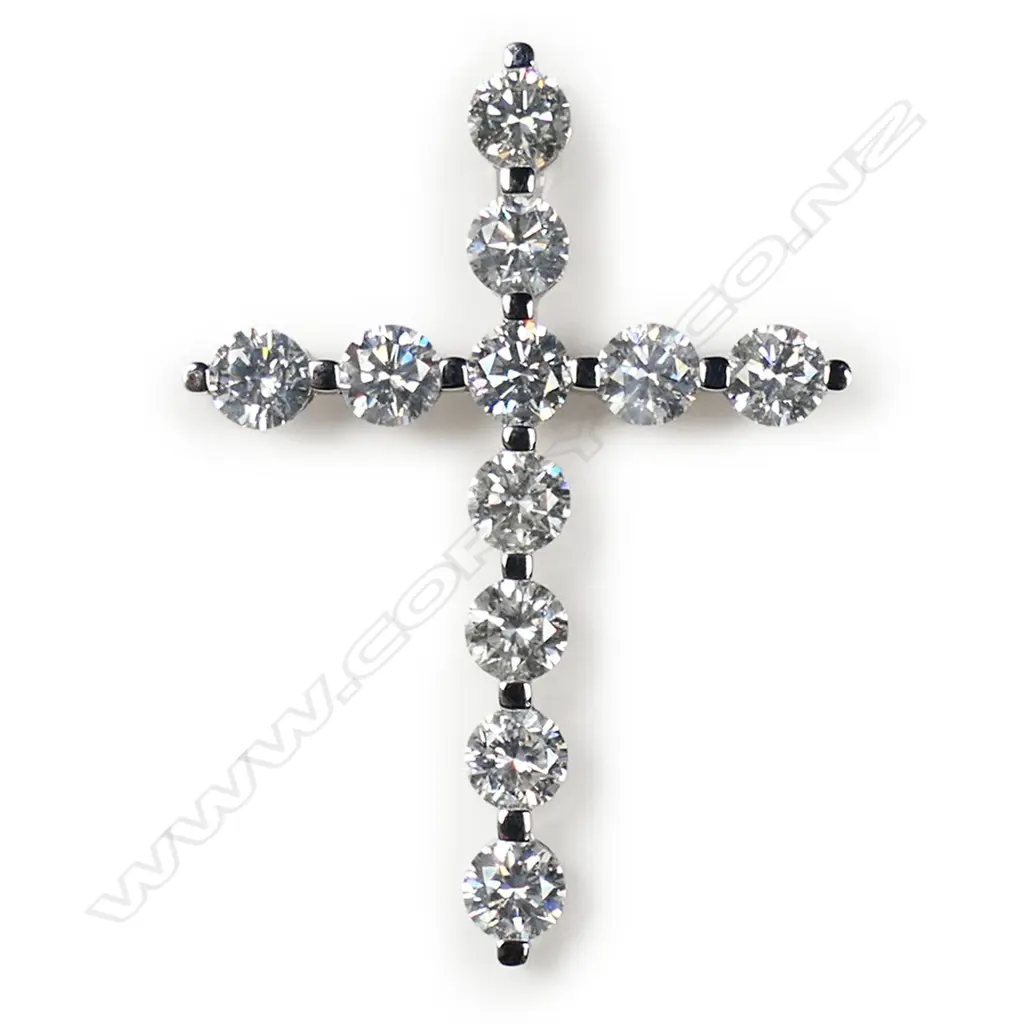 A 14ct white gold and diamond cross pendant, Image 1++