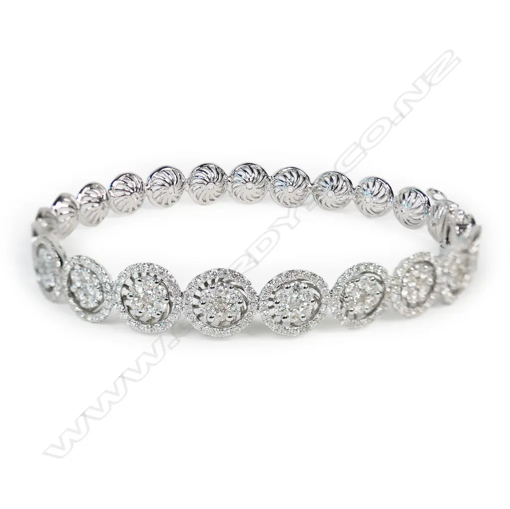 An 18ct white gold and multi diamond bangle, Image 1++