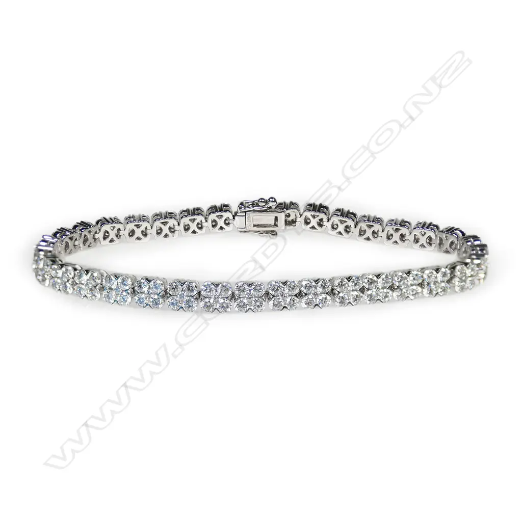 An 18ct white gold and multi diamond tennis type bracelet, Image 1++