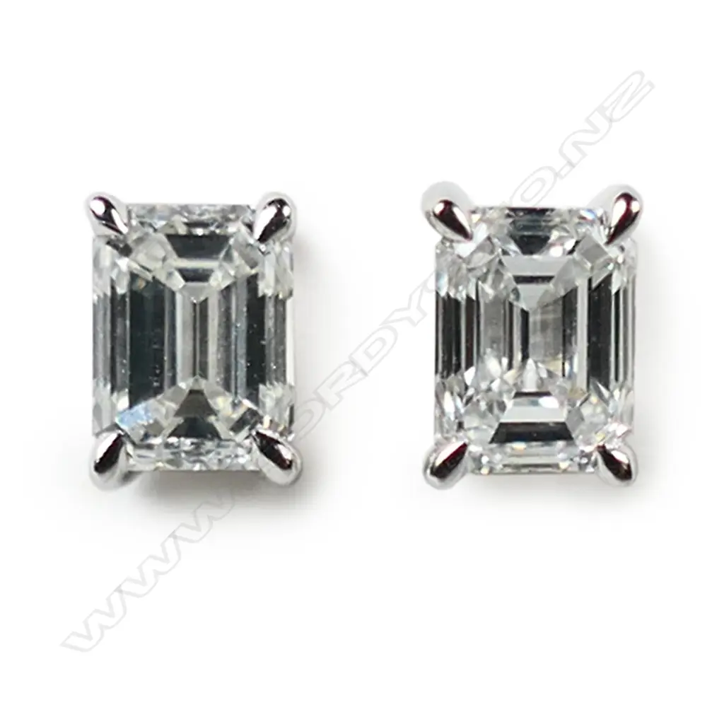 A pair of 18ct white gold and solitaire diamond stud earrings, Image 1++