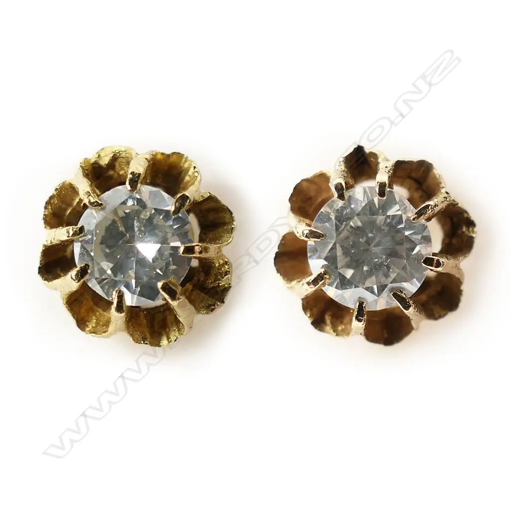 A pair of 9ct gold and diamond stud earrings, Image 1++
