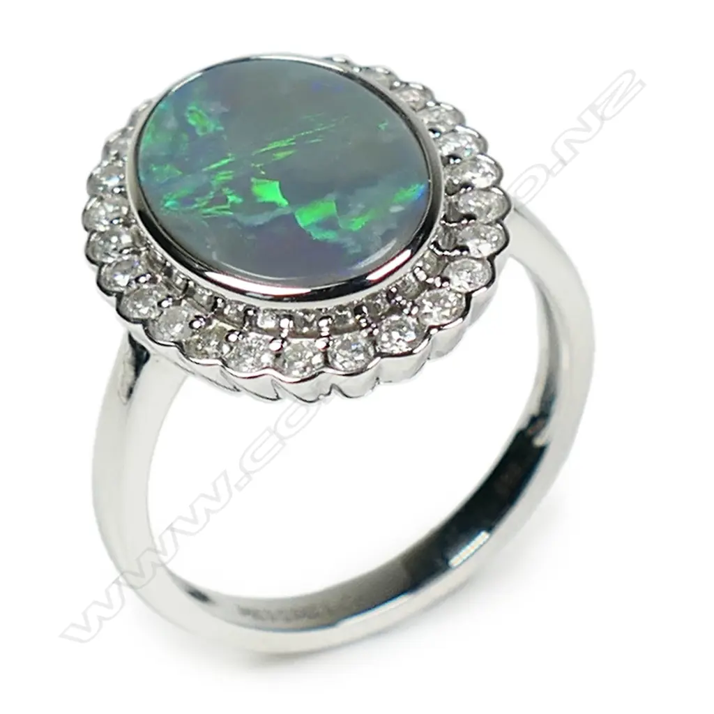 A 14ct white gold Lightening Ridge opal and diamond halo ring, Image 1++
