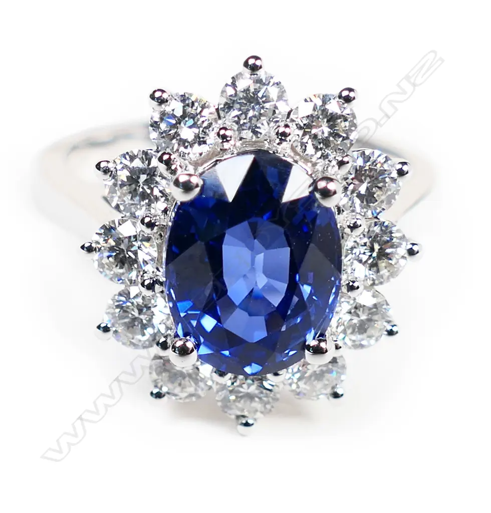 A good 18ct white gold synthetic sapphire and diamond cluster Princess Diana ring, Image 1++