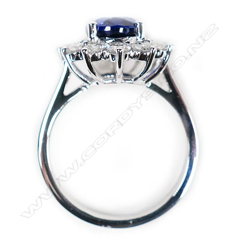 A good 18ct white gold synthetic sapphire and diamond cluster Princess Diana ring, Image 1++