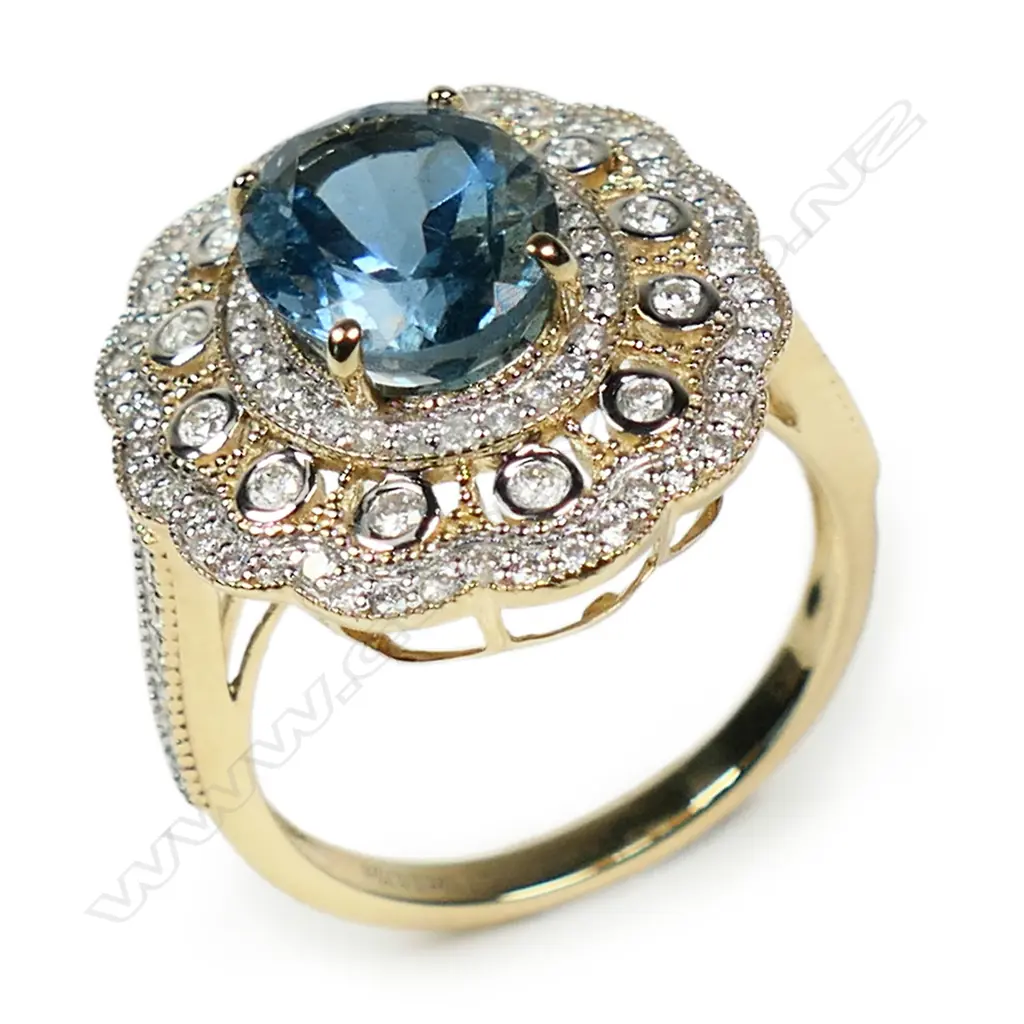 A 14ct yellow and white gold aquamarine and diamond double halo statement ring, Image 1++