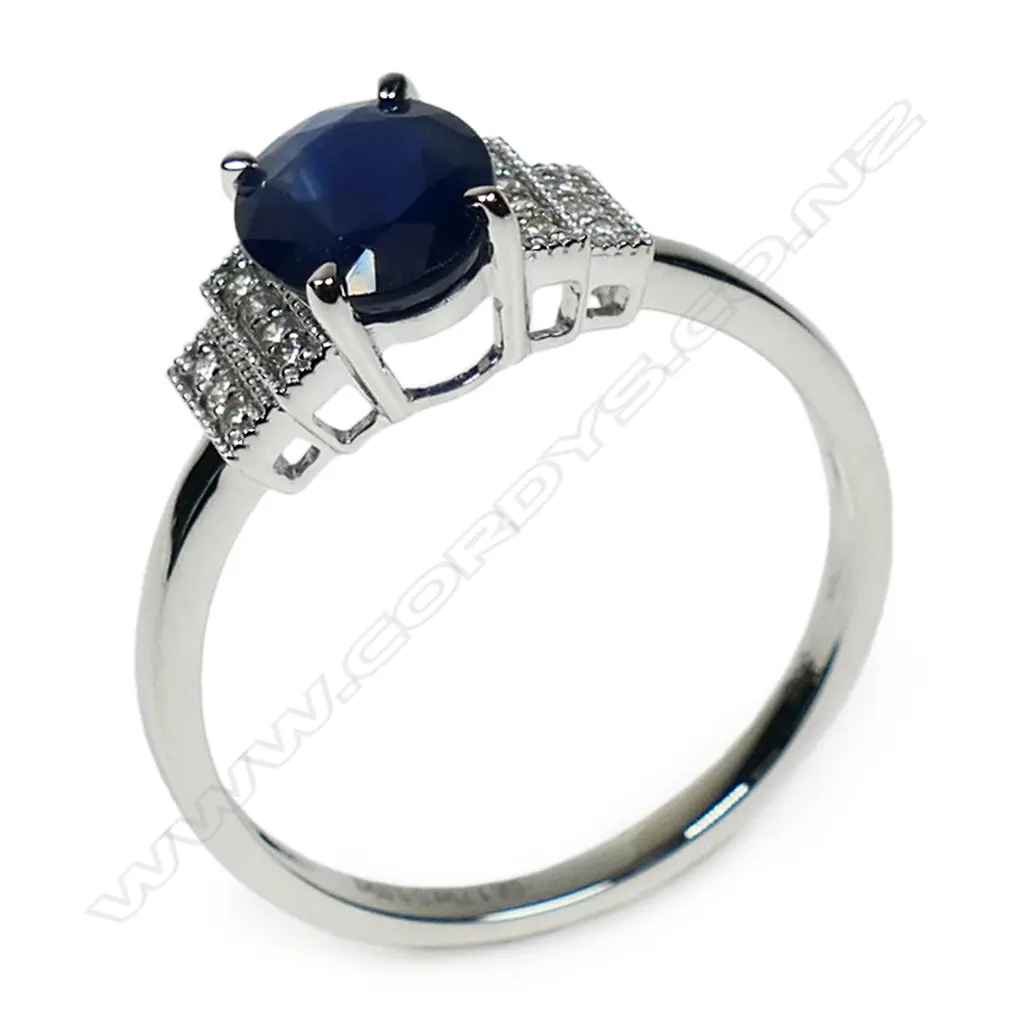 A 14ct white gold diamond and sapphire ring, Image 1++