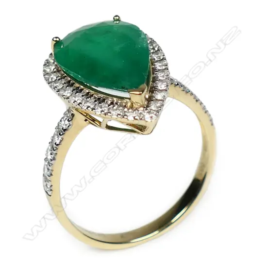 A 14ct yellow and white gold emerald and diamond ring,
