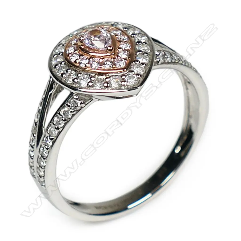 A 14ct white and rose gold pink diamond double halo ring, Image 1++