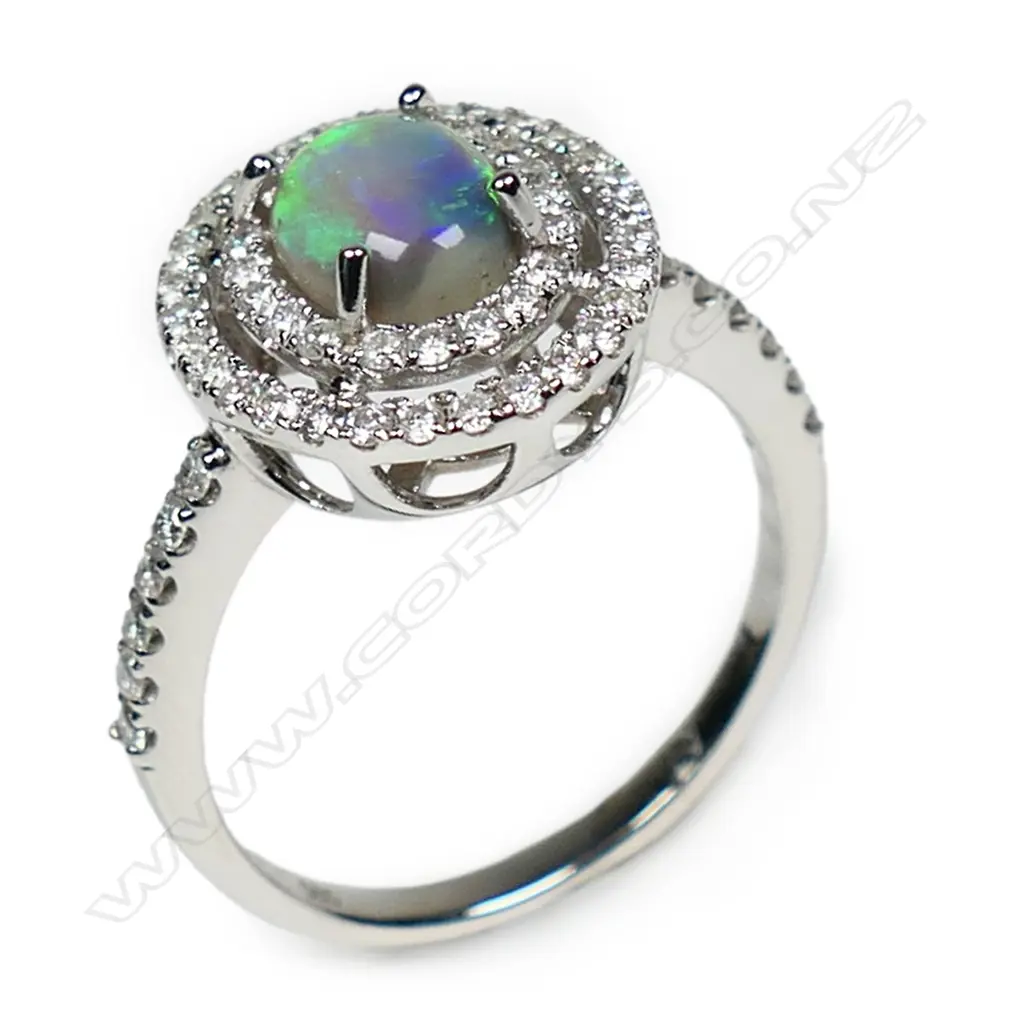 A 14ct white gold opal and diamond double halo ring, Image 1++