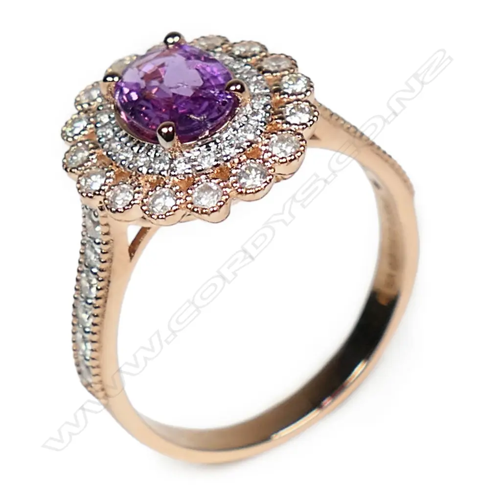 A 14ct rose gold pink sapphire and diamond double halo ring, Image 1++