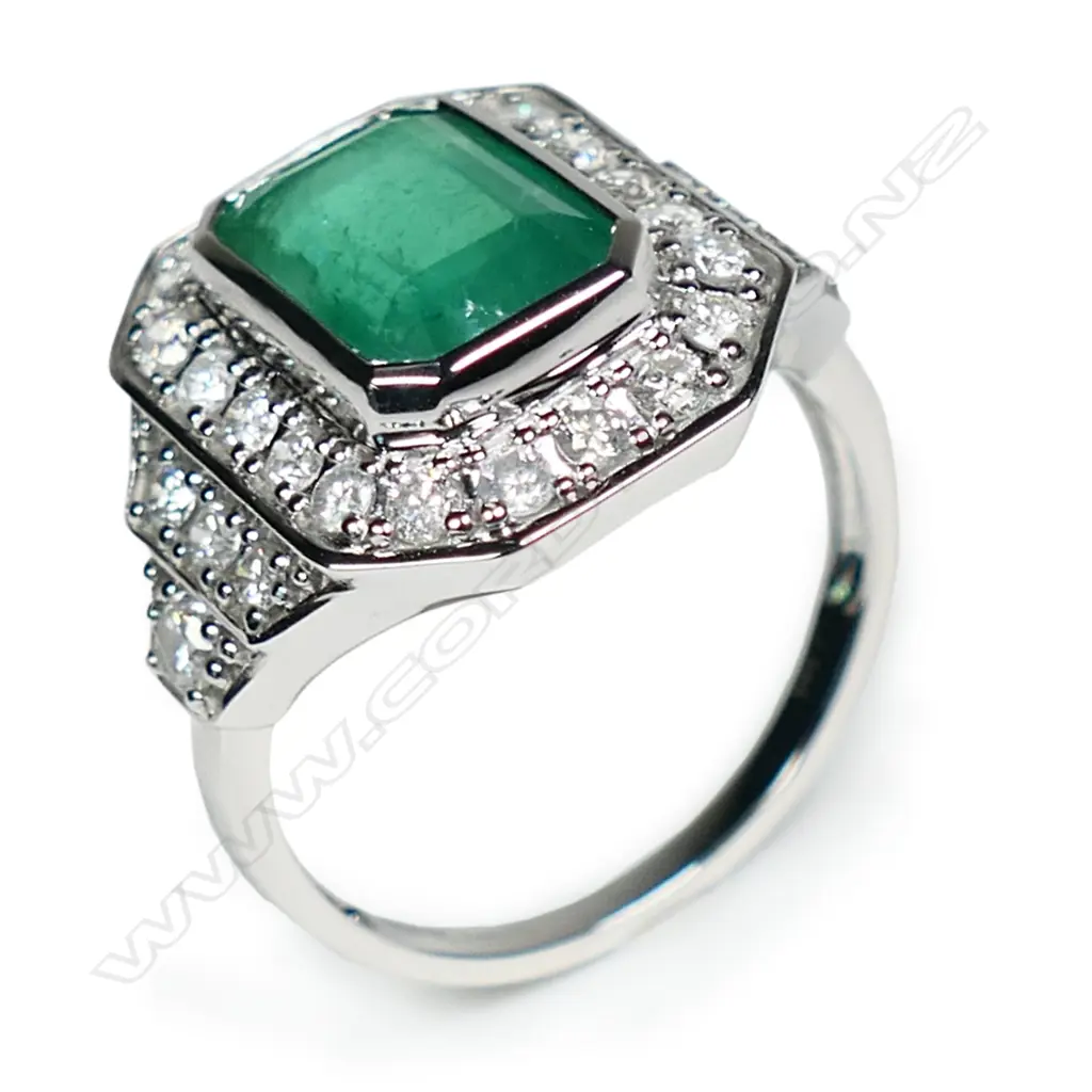 A 14ct white gold emerald and diamond ring, Image 1++