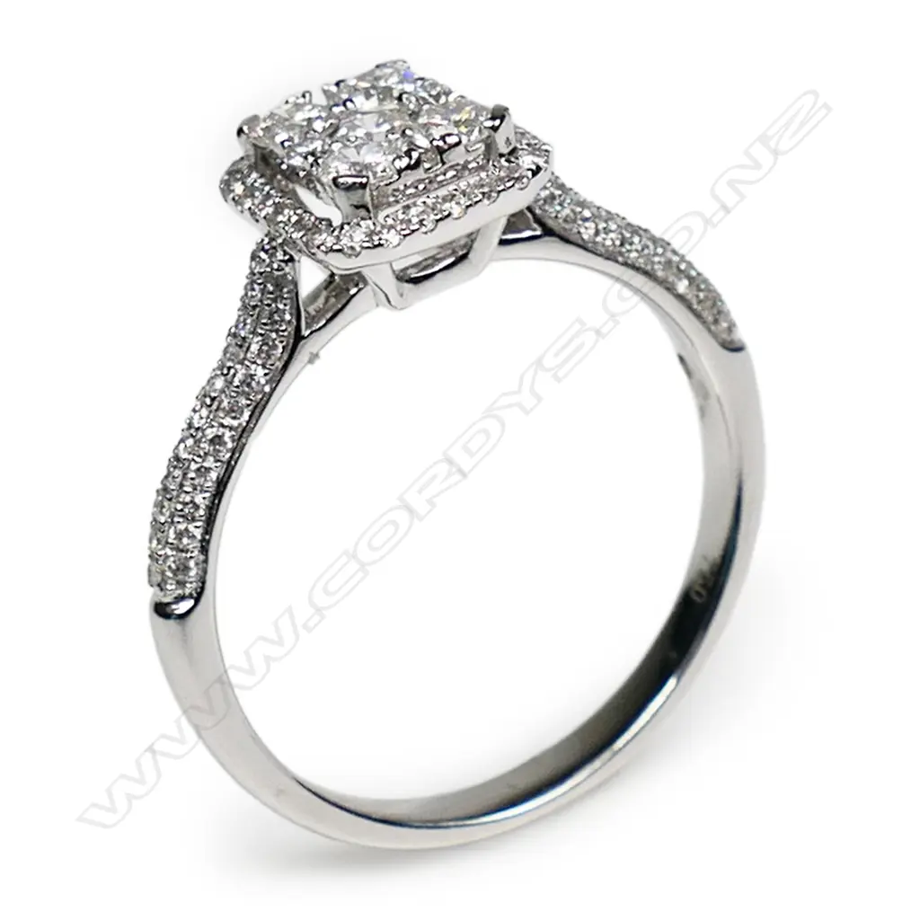 An 18ct white gold diamond cluster ring Image 1++