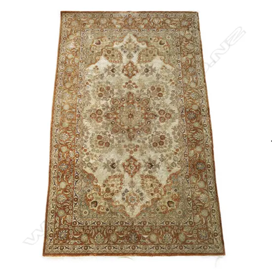A fine hand-knotted all silk rug,