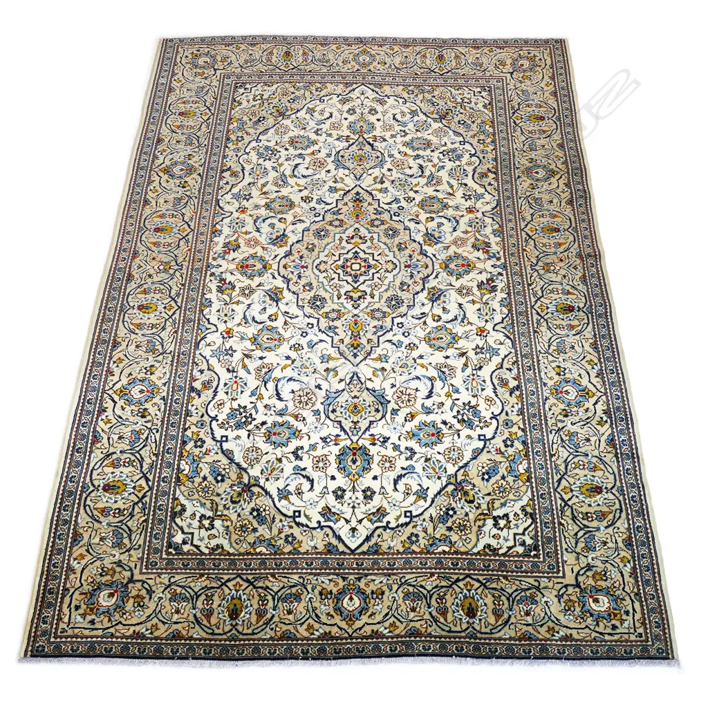 A quality hand-knotted Kashan carpet, the field decorated with a central medallion surrounded by flowing tendrils and conforming small medallions on an ivory ground, deep cream quadrants, multiple border guards. Image 1++