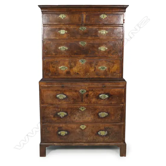 A George III figured walnut chest on chest,