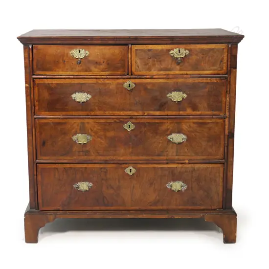 A George III figured walnut five drawer chest,