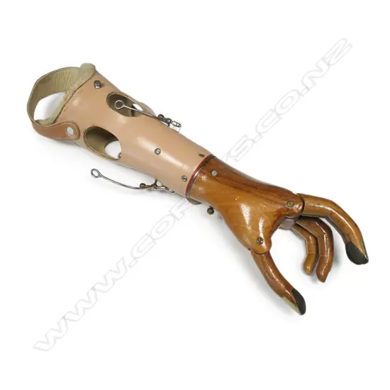 A vintage wood articulated artificial hand,