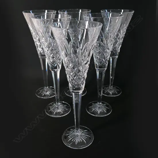 A set of six Waterford toasting champagne flutes,