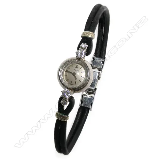 An 18ct white gold and diamond ladies Omega cocktail wrist watch,