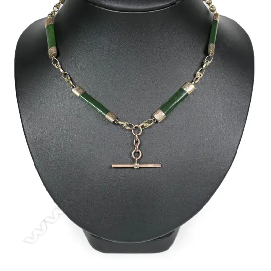 A colonial 9ct rose gold and pounamu fob chain,