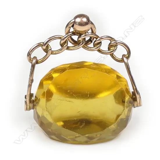 A 9ct yellow gold and citrine toned fob spinner,