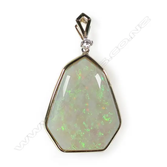 A quality large opal gold and diamond pendant,
