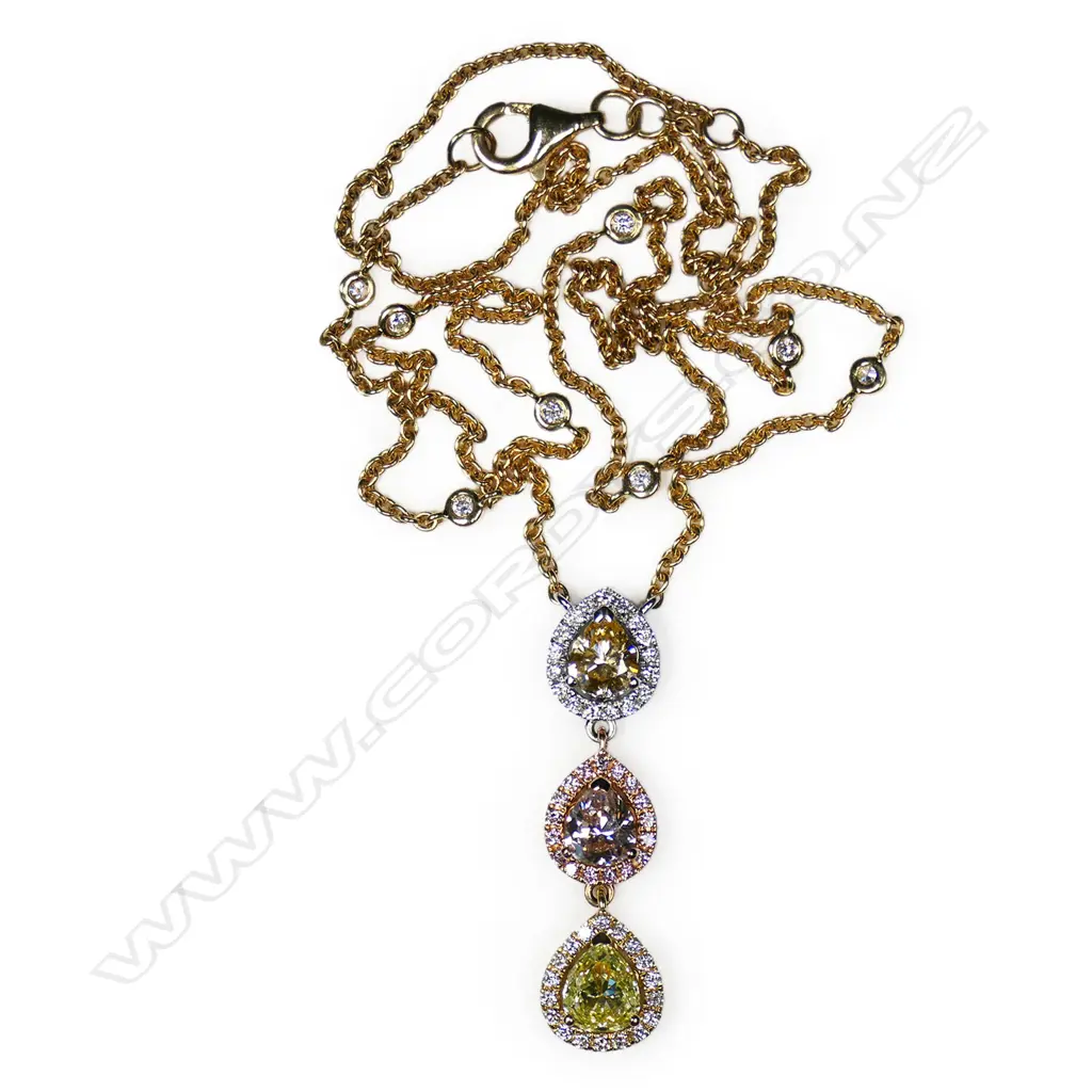 An 18ct white rose and yellow gold graduated pear shaped diamond drop necklace, Image 1++