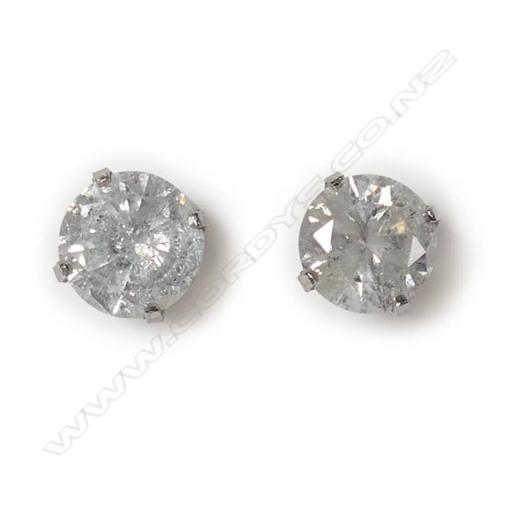 A pair of 14ct white gold and diamond stud earrings, Image 1++