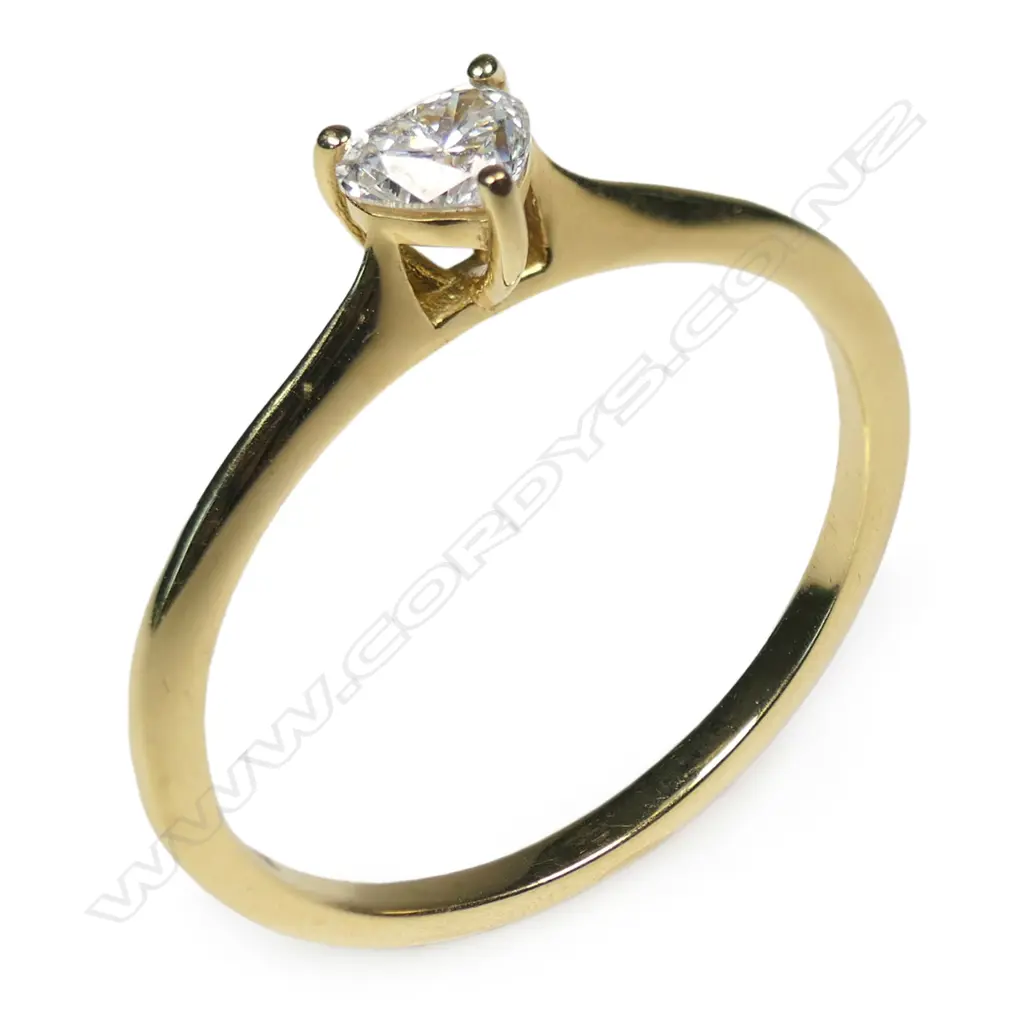 An 18ct gold and diamond solitaire ring, Image 1++