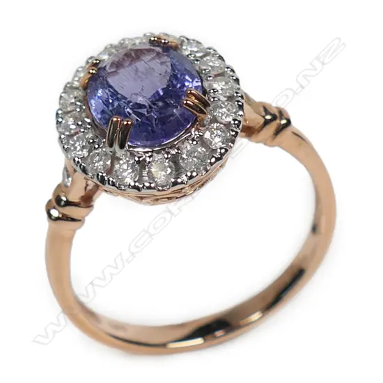 A 14ct rose gold tanzanite and diamond halo ring,