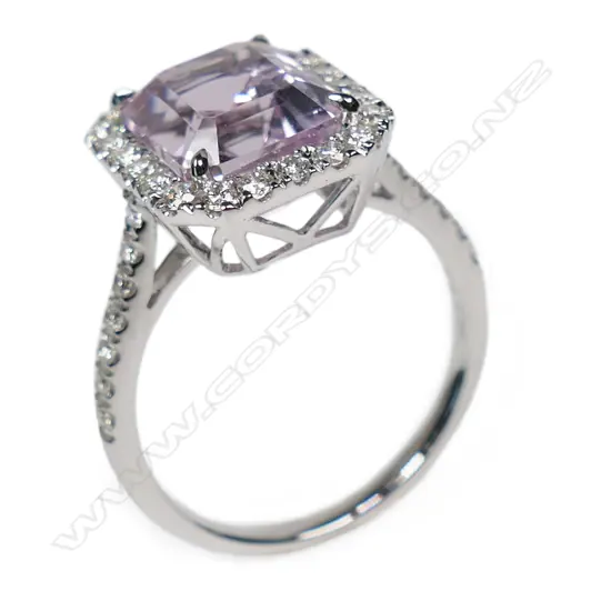 A 14ct white gold kunzite and diamond halo ring,