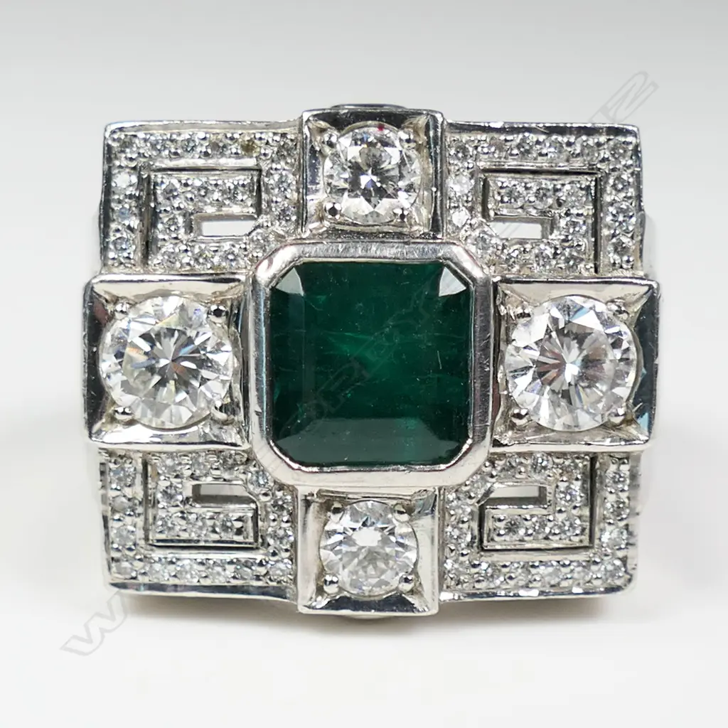 An impressive platinum emerald and diamond dress ring, Image 1++