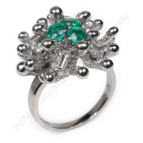 A retro 18ct white gold emerald and diamond ring,