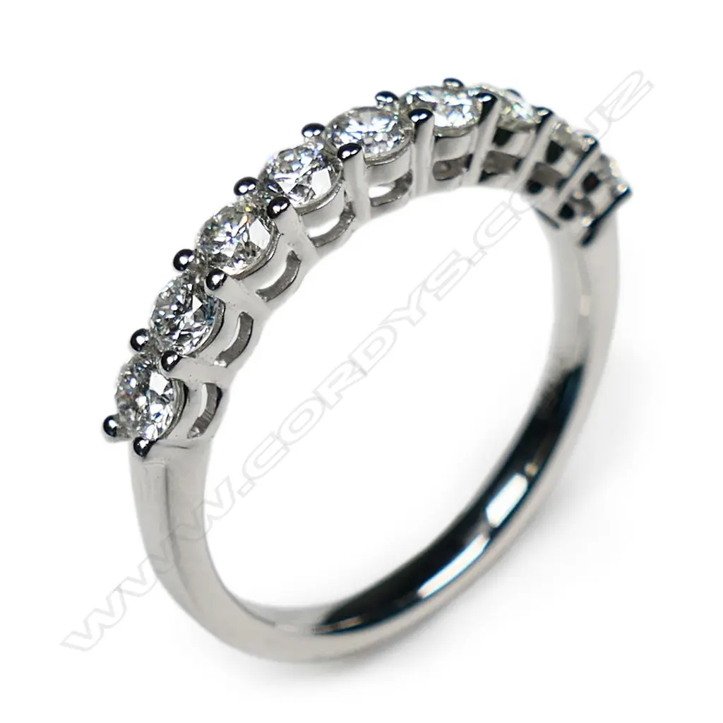 A platinum and diamond band ring, Image 1++