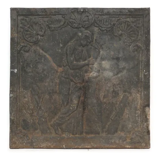 An antique heavy steel fire back plate,