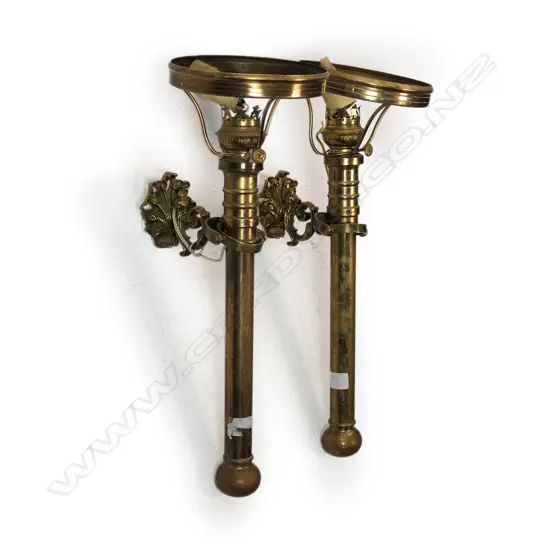 A pair of 20thC brass gimballed ship's saloon lamps,