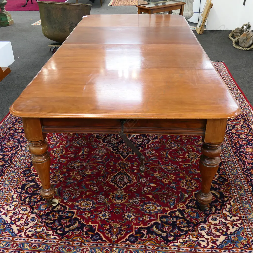 A Victorian mahogany two leaf extension dining table, Image 1++
