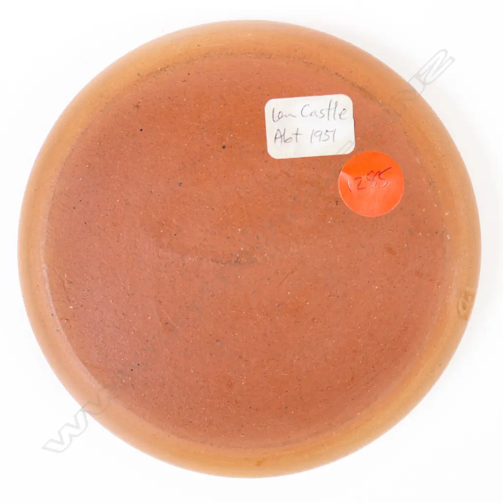 Len Castle ‘pin dish”  with a blue glaze inside with three stylised leaping human figures in white glaze. Red-brown coloured clay body. Stamped mark near the base. Dia.105mm. Image 1++