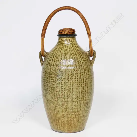 An early Mirek Smisek tall wine bottle. With two lugs