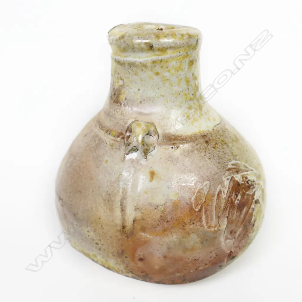 Chester Nealie anagama glaze squat bottle variable glaze and shell effects. H.95mm. Impressed potter's mark. Labelled Image 1++